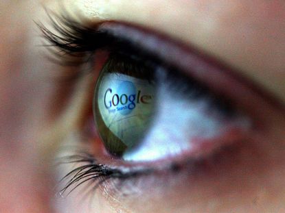 The Google logo reflected on an eye