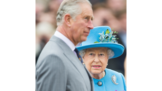Queen Elizabeth II looking at son Prince Charles