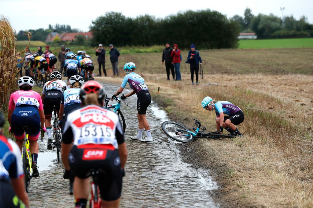 ROUBAIX FRANCE OCTOBER 02 Elizabeth Bennett of United Kingdom and Team DropsLe Col Supported By Tempur and teammate crash through Warlaing Brillon cobblestones sector during the 1st ParisRoubaix 2021 Womens Elite a 1164km race from Denain to Roubaix ParisRoubaixFemmes ParisRoubaix on October 02 2021 in Roubaix France Photo by Bas CzerwinskiGetty Images