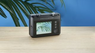 A black Leica Sofort 2 hybrid instant camera