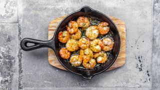 Cooked prawns in skillet