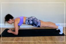 Fitness trainer demonstrating 30 day plank challenge position