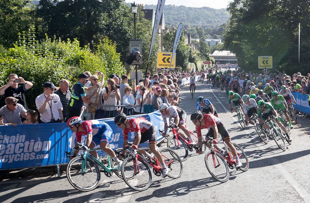The peloton rounds the final corner at the Tour of Britain