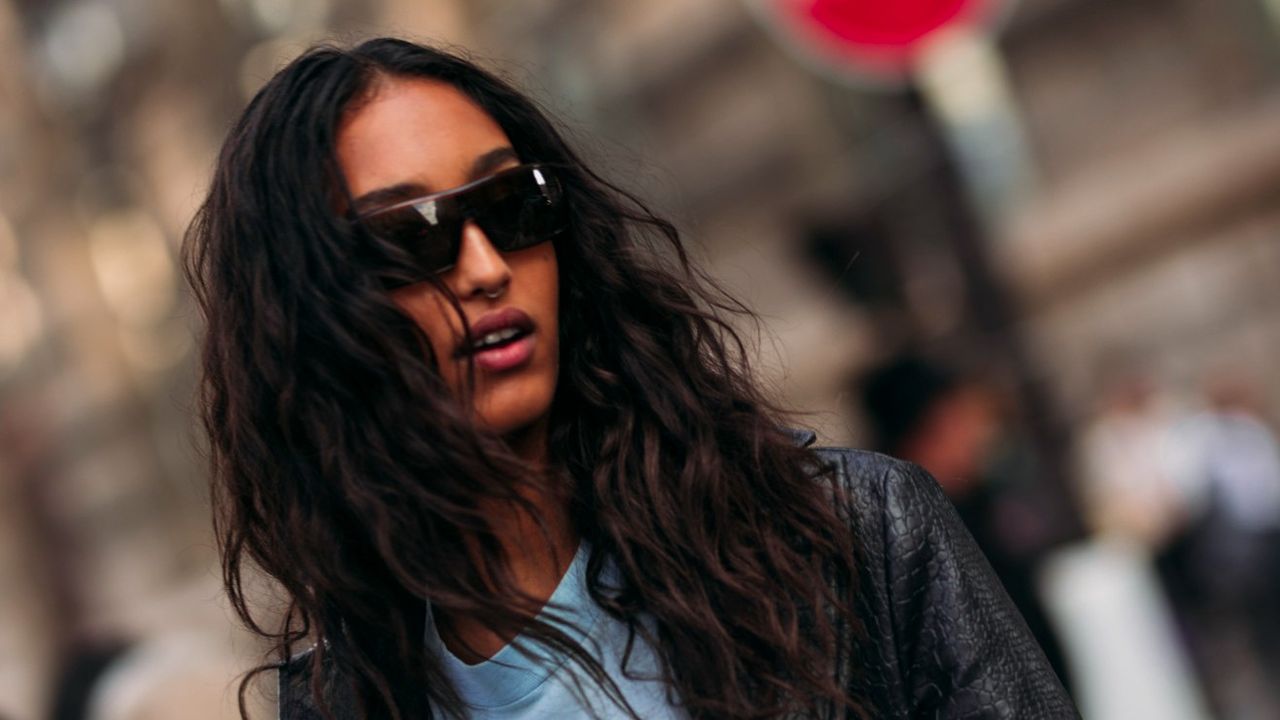 woman in sunglasses with wavy hair