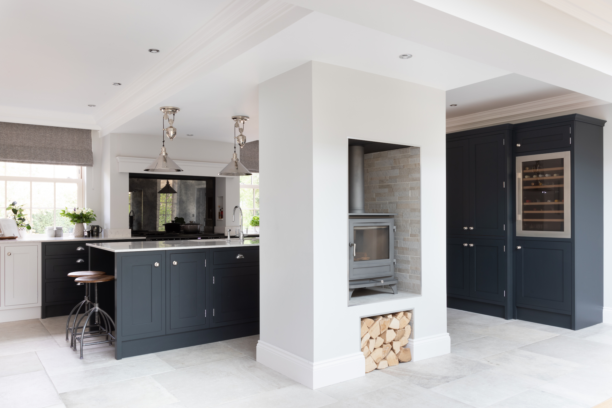 Shaker kitchen with black and white cabinetry and quartz countertops