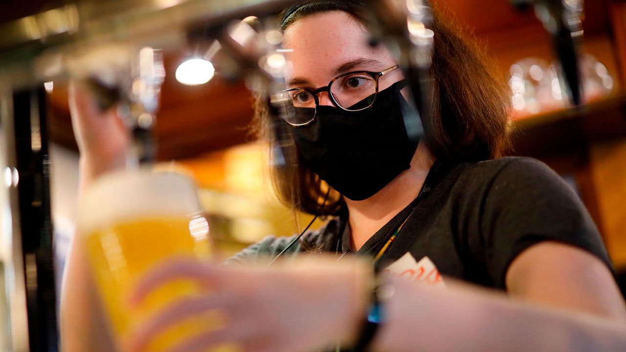 Person pouring a pint