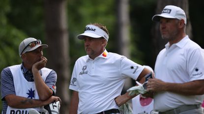 Lee Westwood and Ian Poulter wait on a tee box