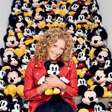 curly hair lady with so manty teddies