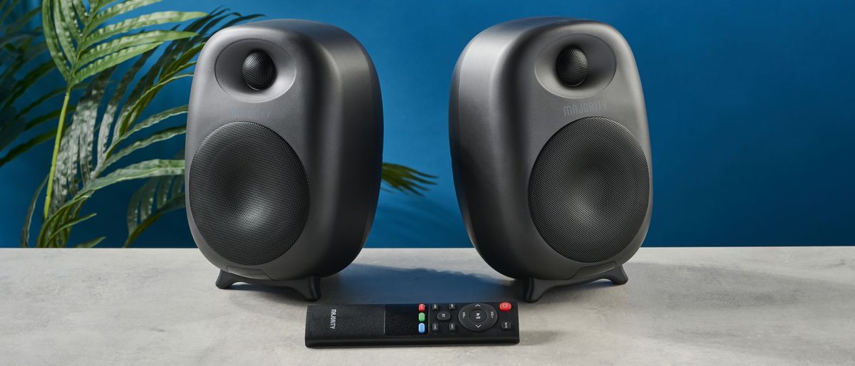 the majority d80 speakers, a pair of black egg-shaped speakers with mesh casing, HDMI, bluetooth, aux connectivity 