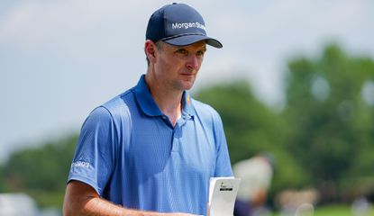 Justin Rose looks up from his yardage book