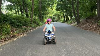 Girl rides Droyd Fury ATV on street