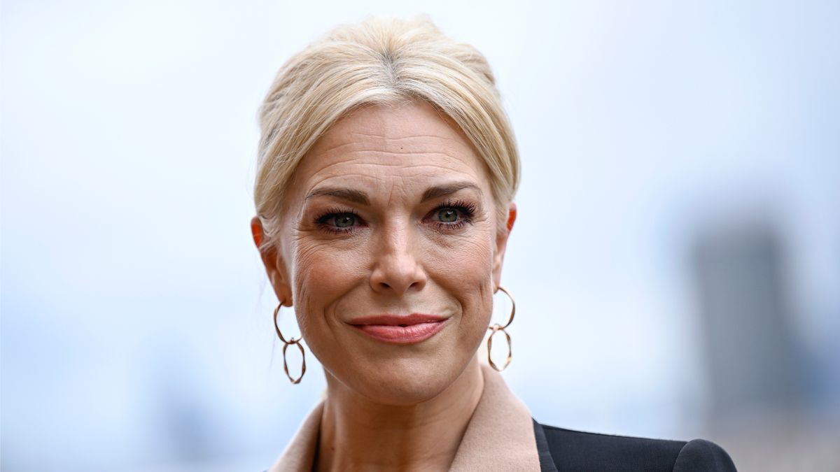 Hannah Waddingham wearing a blazer and collared pink shirt for the Ted Lasso season 3 photo call at Battersea Power Station in April 2023