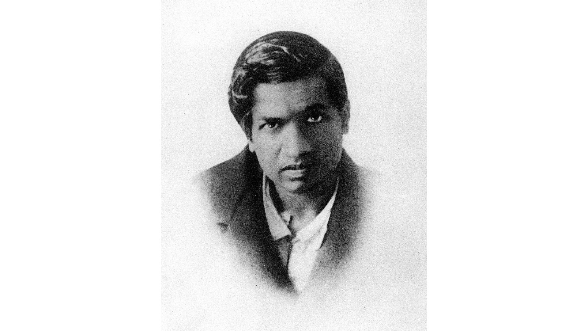 Portrait photograph of mathematician Srinivasa Ramanujan.