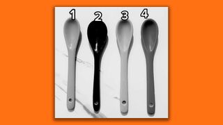 A black and white photo of four spoons
