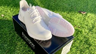 FootJoy Fuel Women's golf shoes with FootJoy box on grass