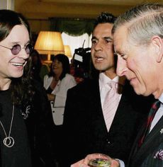 King Charles laughing with Ozzy Osbourne