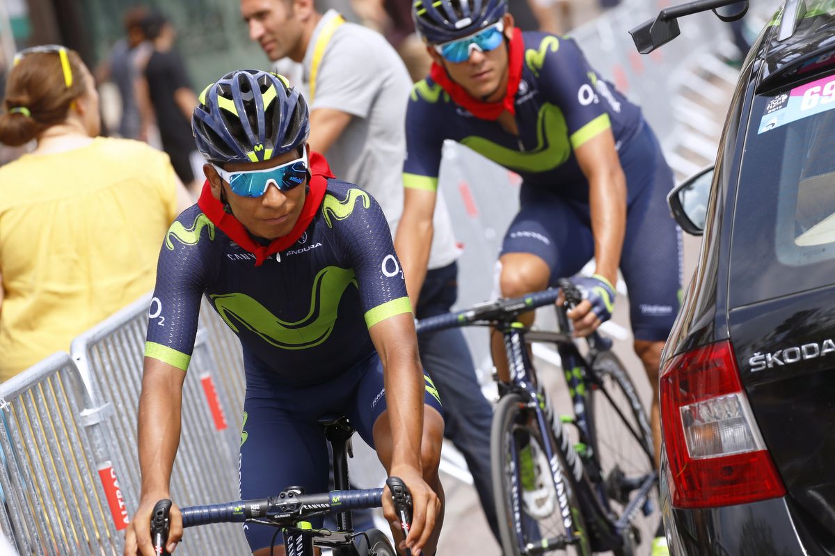 Nairo Quintana wearing the red Pamplona scarf in recognition of its national day