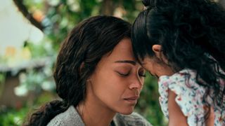 Zoe Saldana as Amy consoling her daughter in From Scratch