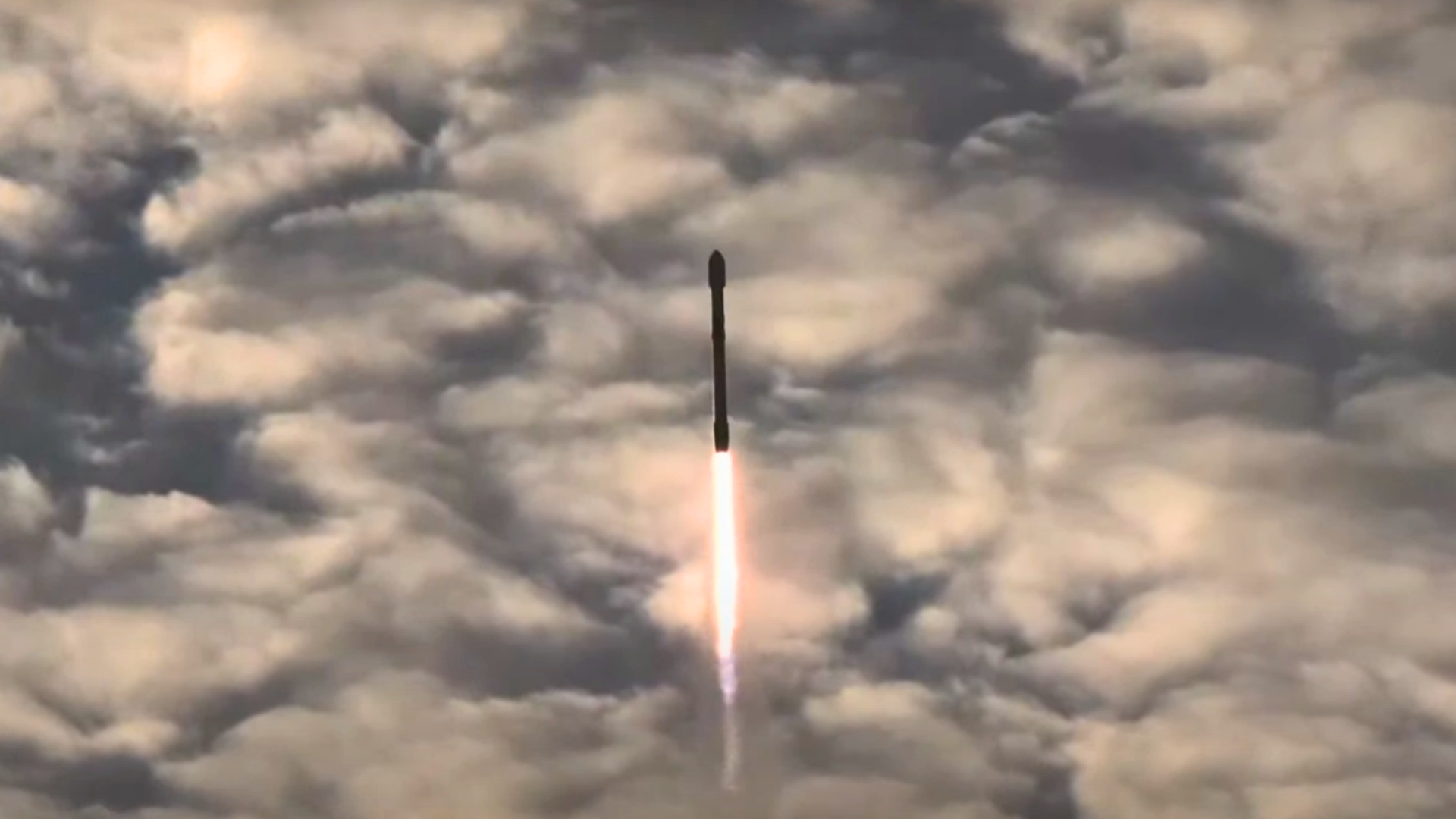 SpaceX launch Sept. 24. rocket seen against a background of clouds