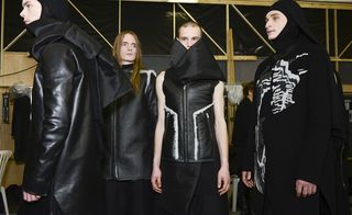 Males modelling black leather outifts