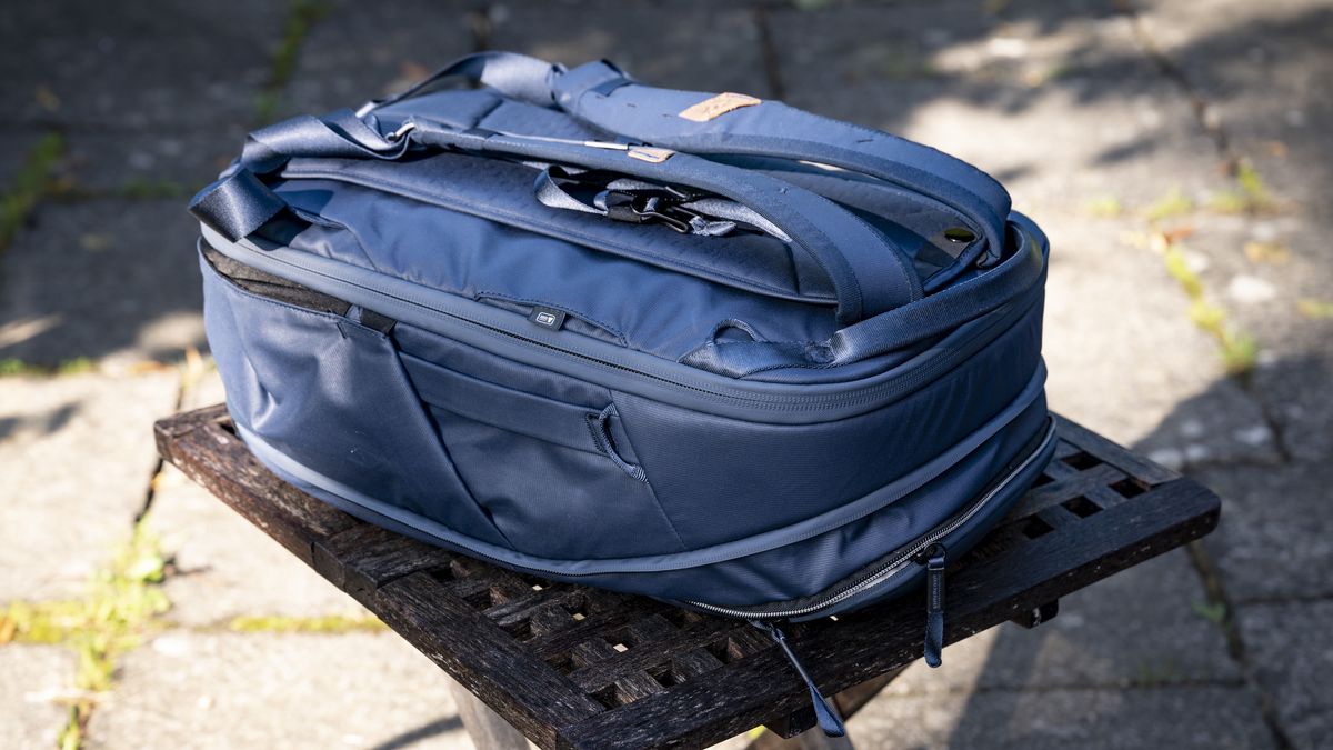 Peak Design Camera Cubes inside Traveller Backpack on wooden table outside