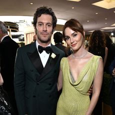 Adam Brody and Leighton Meester attend the 82nd Golden Globe Awards