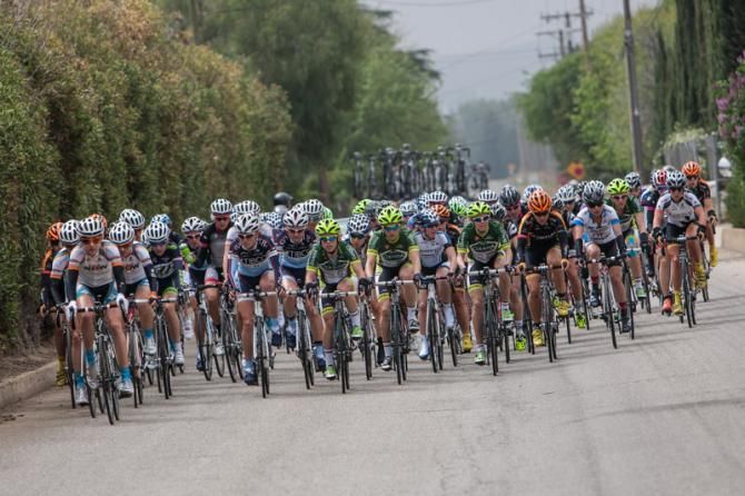 The women's field gets bunched up with the break up the road.