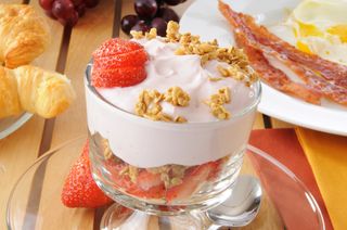 A yogurt parfait with fruit and granola
