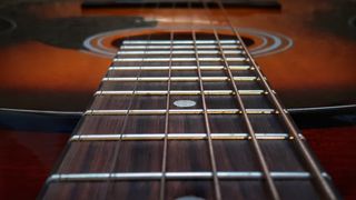 Close up of acoustic guitar strings