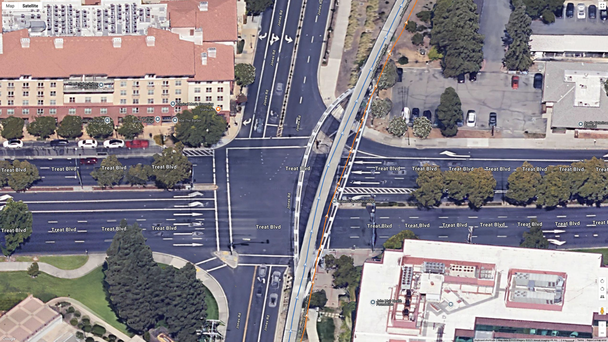 A Google Maps satellite image showing how the COROS PACE 4 (blue line) compares to the Garmin Forerunner 970 (orange line) for dual-frequency GPS accuracy for a suburban route.