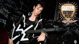 Des Rocs poses with his Aviator The Rocket electric guitar