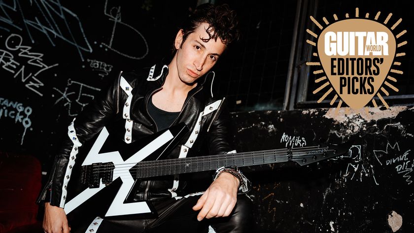 Des Rocs poses with his Aviator The Rocket electric guitar