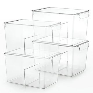 Four clear plastic deep storage bins with lids