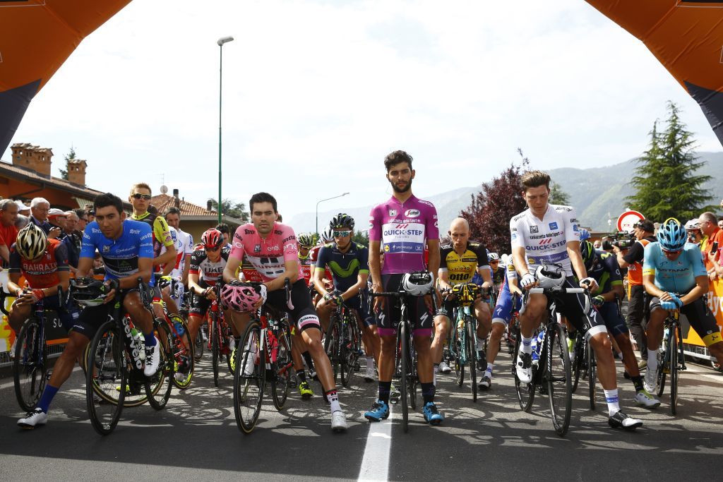 The peloton pauses for a minute's silence in memory of the victims of the Manchester bombing, motorcyclist Nicky Hayden and triathlete Julia Viellehner
