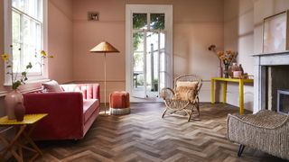 herringbone effect flooring in period living room with modern furniture