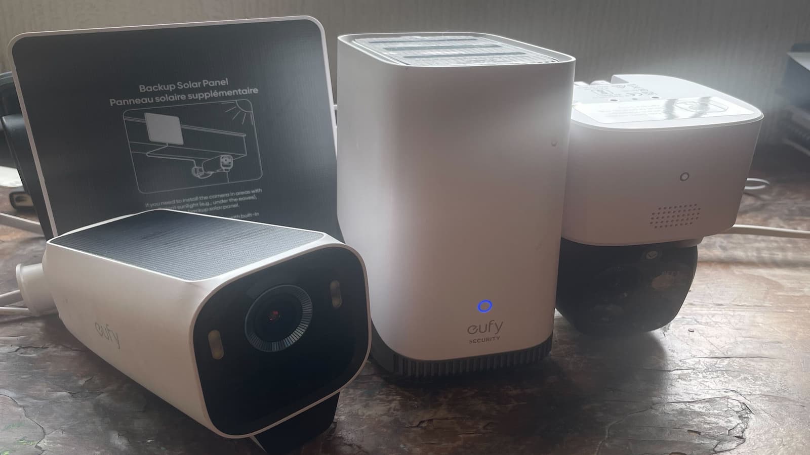 A set of eufy cameras with a solar panel