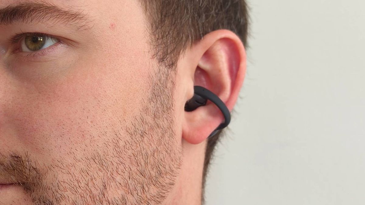 The Shokz OpenDots Air in a man's ear.