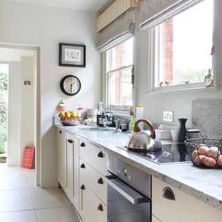 kitchen with white walls and marble worktop