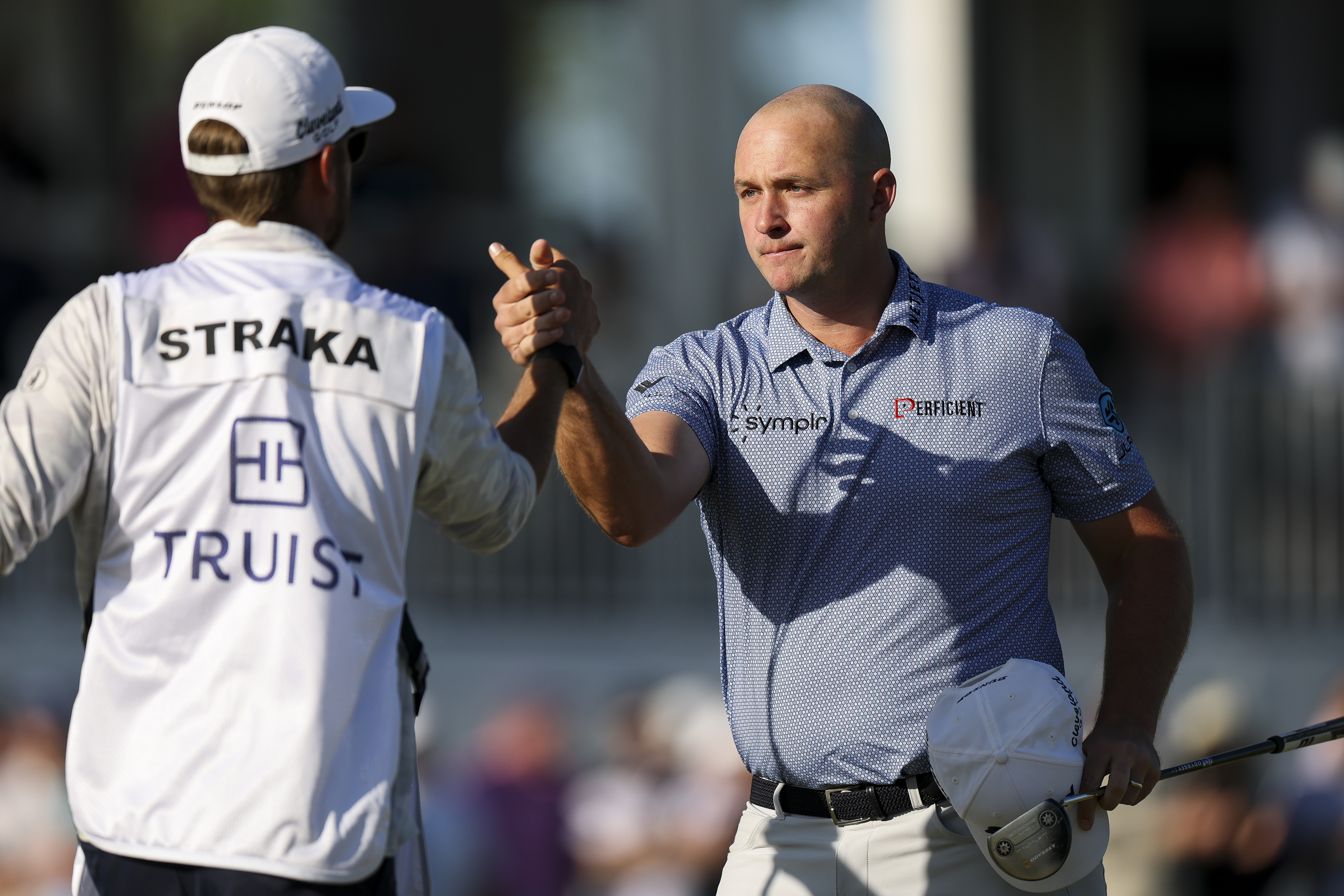 Sepp Straka shakes hands with his caddie