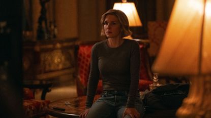 Carol (Rhea Seehorn) sitting down in Pluribus