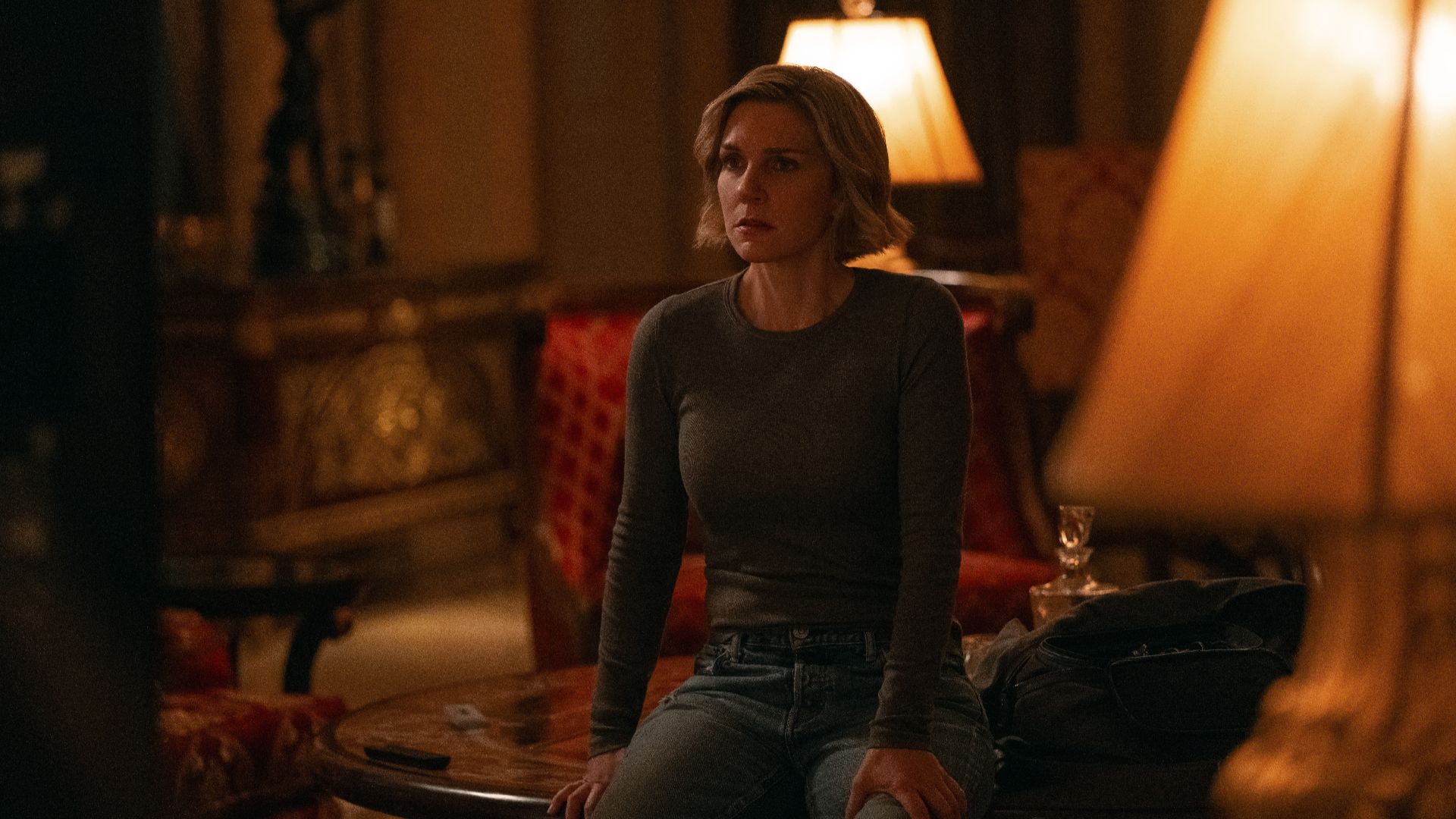 Carol (Rhea Seehorn) sitting down in Pluribus