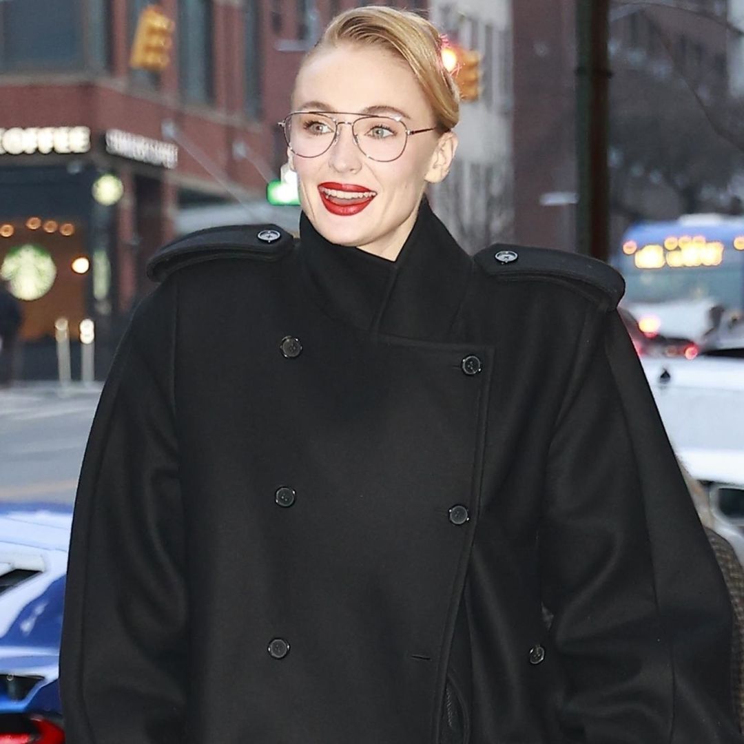 Sophie Turner arrived in New York City wearing an oversize take on the military coat trend