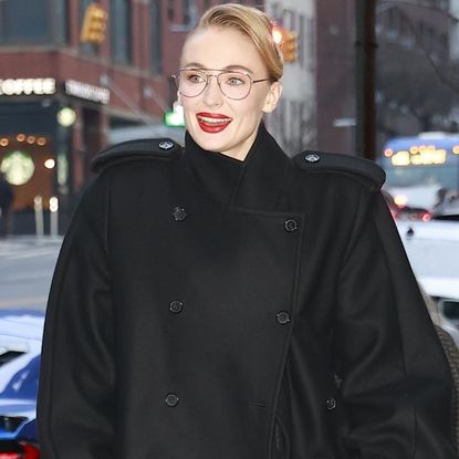 Sophie Turner arrived in New York City wearing an oversize take on the military coat trend