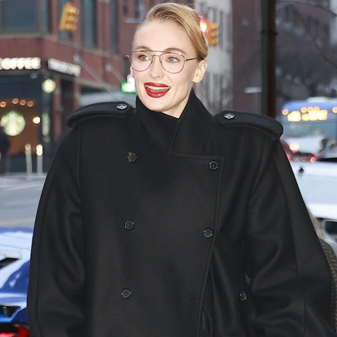 Sophie Turner arrived in New York City wearing an oversize take on the military coat trend