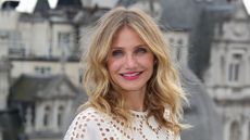 cameron diaz smiling with red lipstick on