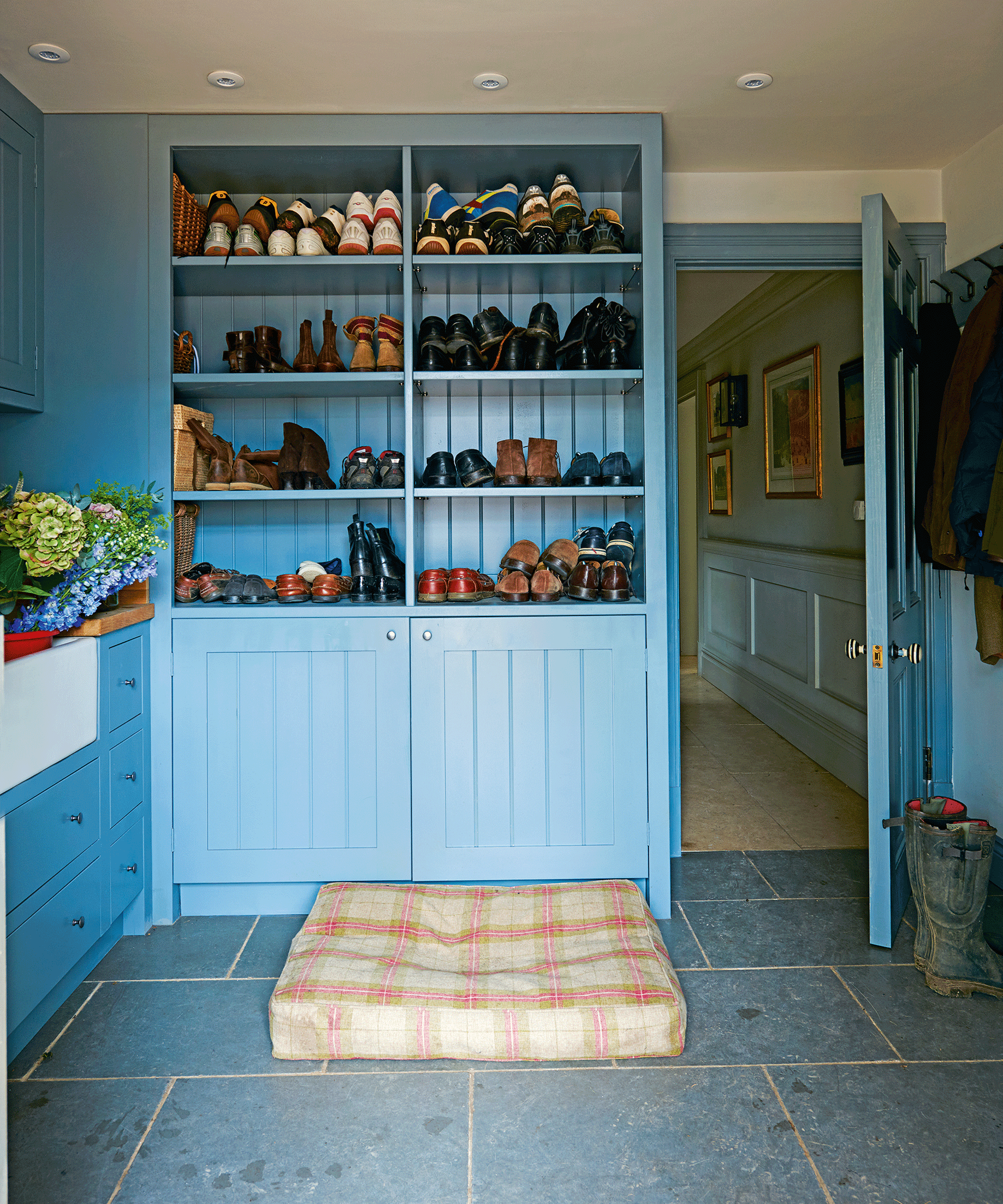 Blue shoe storage in utility room