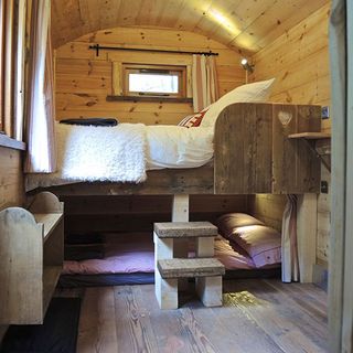 wooden bedroom with two bedlinen