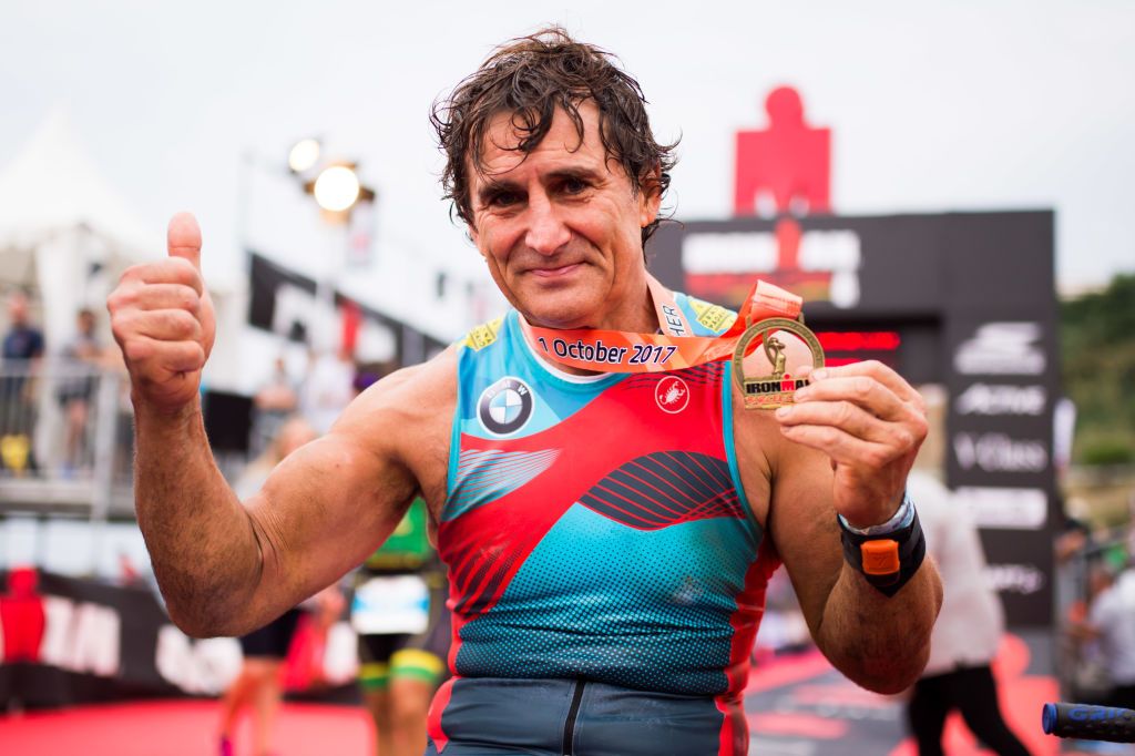 BARCELONA SPAIN SEPTEMBER 30 Former Formula One driver and paracyclist Alex Zanardi poses after finishing IRONMAN Barcelona on September 30 2017 in Calella Barcelona province Spain Photo by Alex CaparrosGetty Images for IRONMAN