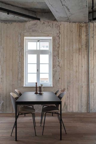 Table and chairs smooth finish with exposed walls and roof raw materials
