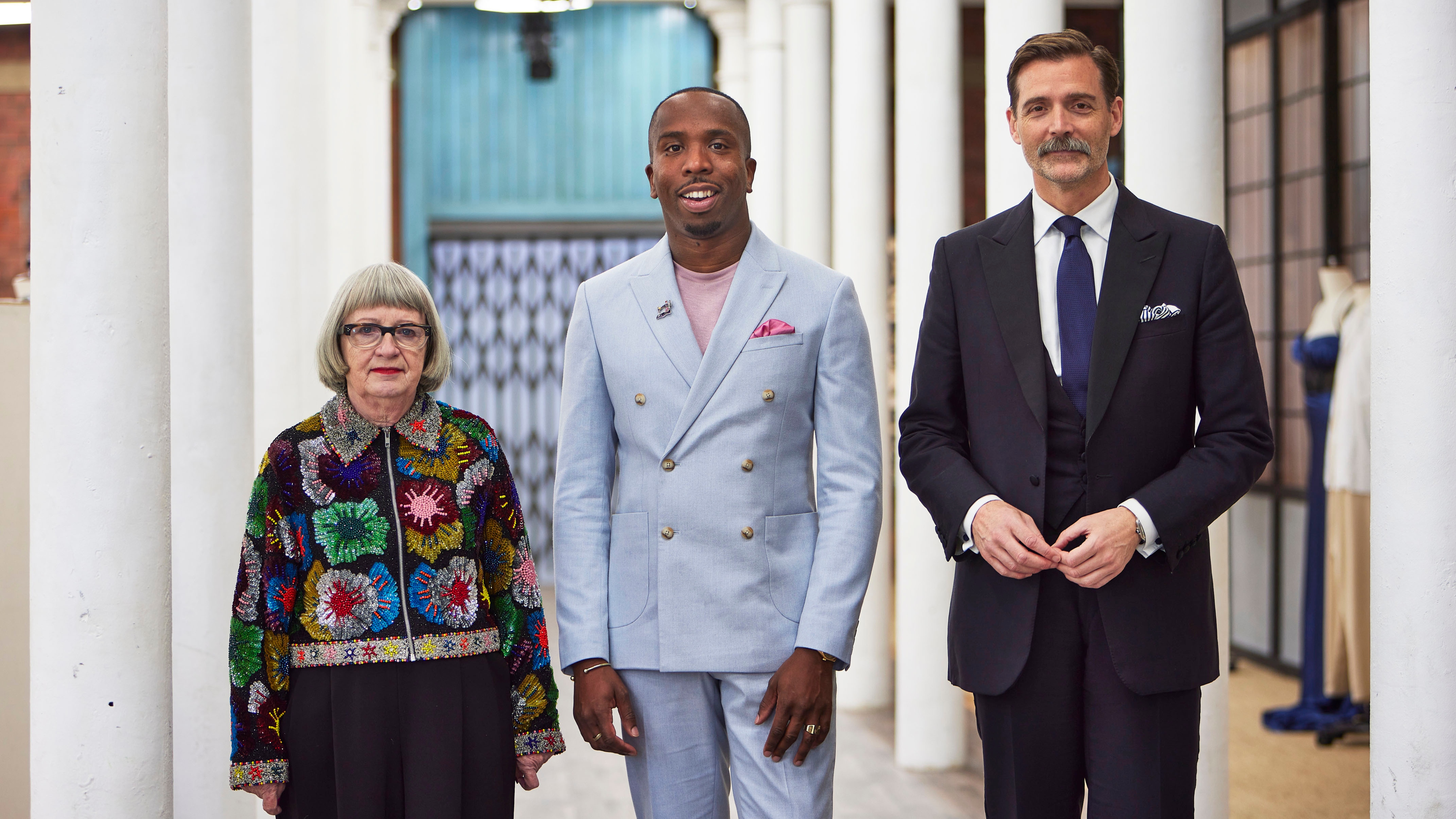 Esme Young, Kiell Smith-Bynoe and Patrick Grant lined up in the sewing bee studios